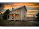 Charming two-story home with a welcoming front porch and additional building on the property at 2416 Glencoe St, Burlington, NC 27217