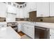 Modern kitchen featuring stainless steel appliances, white cabinets, and marble countertops at 2416 Glencoe St, Burlington, NC 27217