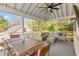 Inviting screened-in porch with outdoor seating and dining area, perfect for entertaining at 2416 Glencoe St, Burlington, NC 27217