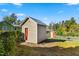 Several backyard sheds and fenced area, perfect for storage, hobbies, and outdoor living at 2416 Glencoe St, Burlington, NC 27217