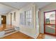 Bright sunroom featuring large windows, hardwood floors, and easy access to the backyard at 2416 Glencoe St, Burlington, NC 27217