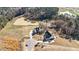 Aerial view of two homes near pond showcasing the driveways and well-maintained surroundings at 25 Firefly Ln, Youngsville, NC 27596