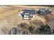 A high aerial view of a new home, showing roof, and landscaping, sitting on a large lot at 25 Firefly Ln, Youngsville, NC 27596