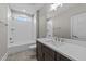 Modern bathroom features a vanity with a large mirror, a shower-tub combo, and neutral walls at 25 Firefly Ln, Youngsville, NC 27596