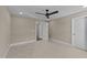 Bedroom with neutral walls and carpet, with an open door leading to another room at 25 Firefly Ln, Youngsville, NC 27596