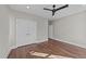 Spacious bedroom with closet, a modern ceiling fan, and a neutral color scheme at 25 Firefly Ln, Youngsville, NC 27596