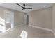 Spacious bedroom with carpet and neutral walls with multiple doors leading to other areas at 25 Firefly Ln, Youngsville, NC 27596