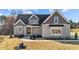 Charming home featuring a gray exterior, complemented by well-maintained landscaping at 25 Firefly Ln, Youngsville, NC 27596