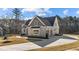 An elegant home with a spacious driveway and a well-maintained lawn at 25 Firefly Ln, Youngsville, NC 27596