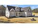 Beautifully designed home with a gray exterior, attractive roofline and manicured front yard at 25 Firefly Ln, Youngsville, NC 27596