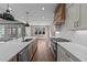 Modern kitchen featuring an island and stainless appliances with a dining area and lots of light at 25 Firefly Ln, Youngsville, NC 27596