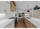 Modern kitchen featuring white cabinets, quartz counters, and a center island at 25 Firefly Ln, Youngsville, NC 27596