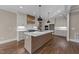 Bright kitchen featuring white cabinets, stainless appliances, quartz countertops, and pendant lights at 25 Firefly Ln, Youngsville, NC 27596