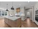 Kitchen with white cabinets, quartz counters and stainless appliances at 25 Firefly Ln, Youngsville, NC 27596