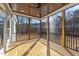 Cozy screened-in porch with a wood ceiling, ceiling fan, wood flooring and view of a wooded backyard at 25 Firefly Ln, Youngsville, NC 27596