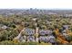 Aerial view showing townhome community near a city skyline at 1001 Brighthurst Dr # 204, Raleigh, NC 27605