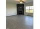 Bright living room with hardwood floors and a decorative fireplace with a stone backsplash at 238 Plains Dr # 313, Burlington, NC 27217