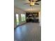 Spacious open-concept living room with hardwood floors leading to a modern kitchen with stainless steel appliances at 238 Plains Dr # 313, Burlington, NC 27217