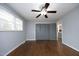 Spacious bedroom with hardwood floors, ceiling fan and ample closet space at 4713 Zebulon Rd, Zebulon, NC 27597