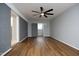 Spacious bedroom with hardwood floors and ceiling fan at 4713 Zebulon Rd, Zebulon, NC 27597