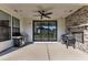 Covered patio with built-in grill and fireplace at 616 Silver Comet Dr, Knightdale, NC 27545