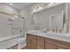 Modern bathroom with double sinks and a tub shower combo at 616 Silver Comet Dr, Knightdale, NC 27545