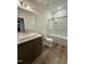 Clean bathroom with single sink, shower, and tub at 616 Silver Comet Dr, Knightdale, NC 27545