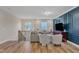Spacious bonus room with blue accent wall, comfy seating, and a large TV at 616 Silver Comet Dr, Knightdale, NC 27545