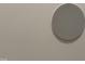 Close-up of a round ceiling speaker mounted on a white wall at 616 Silver Comet Dr, Knightdale, NC 27545