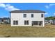 Two-story home with white siding and backyard at 616 Silver Comet Dr, Knightdale, NC 27545