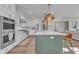 Modern kitchen with green island and stainless steel appliances at 616 Silver Comet Dr, Knightdale, NC 27545