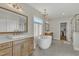 Luxurious bathroom with soaking tub, double vanity, and walk-in shower at 616 Silver Comet Dr, Knightdale, NC 27545