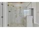 Large walk-in shower with marble tile and gold accents at 616 Silver Comet Dr, Knightdale, NC 27545