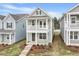 Inviting two-story home with a cozy porch and well-maintained lawn at 707 Georgias Landing Pkwy # 105, Raleigh, NC 27603