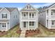 Charming two-story home with a covered porch and landscaped front yard at 707 Georgias Landing Pkwy # 105, Raleigh, NC 27603