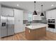 Stylish kitchen with stainless steel appliances, a center island, and pendant lighting at 707 Georgias Landing Pkwy # 105, Raleigh, NC 27603