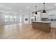 The living area features a kitchen, recessed lights, large windows, and an open floor plan at 707 Georgias Landing Pkwy # 105, Raleigh, NC 27603