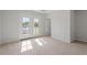 Main bedroom boasts natural light and balcony access with a beautiful view and fresh air at 707 Georgias Landing Pkwy # 105, Raleigh, NC 27603