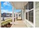 Spacious covered porch with a view of the neighborhood at 707 Georgias Landing Pkwy # 105, Raleigh, NC 27603