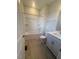 Bathroom featuring wood-look flooring, a shower-tub combo, white cabinetry, and a countertop with sink at 111 Demascus Way # 021, Four Oaks, NC 27524