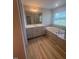 Spacious bathroom with soaking tub, shower, granite countertop, and generous cabinet storage at 111 Demascus Way # 021, Four Oaks, NC 27524