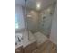 Bathroom shower with glass enclosure, tiled walls, and tiled flooring at 111 Demascus Way # 021, Four Oaks, NC 27524