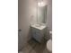 Modern bathroom features a granite countertop, stylish sink, and a sleek mirror at 111 Demascus Way # 021, Four Oaks, NC 27524