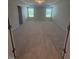 Spacious bedroom with tray ceilings, neutral carpeting and two windows, providing a serene retreat at 111 Demascus Way # 021, Four Oaks, NC 27524