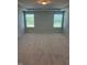 Spacious bedroom with tray ceilings, neutral carpeting and two windows, providing a serene retreat at 111 Demascus Way # 021, Four Oaks, NC 27524