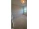 Bright bedroom with neutral carpet, light walls, and a window that fills the room with natural light at 111 Demascus Way # 021, Four Oaks, NC 27524