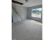 Bonus room featuring a large window and an attic access with pull-down stairs at 111 Demascus Way # 021, Four Oaks, NC 27524