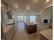 Spacious open kitchen with a large island, stainless steel appliances, and granite countertops at 111 Demascus Way # 021, Four Oaks, NC 27524