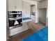 Kitchen area with grey cabinets, light countertops and stainless oven at 111 Demascus Way # 021, Four Oaks, NC 27524