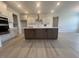 Bright kitchen featuring a large island and stainless steel range hood at 111 Demascus Way # 021, Four Oaks, NC 27524